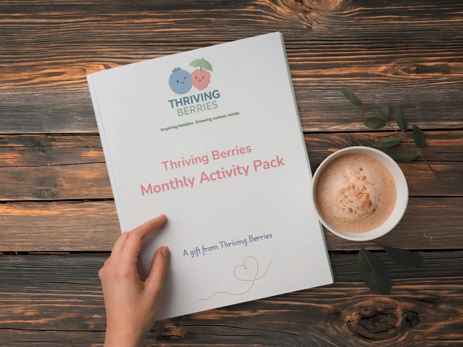 Thriving Berries Monthly Activity Pack on a wooden table