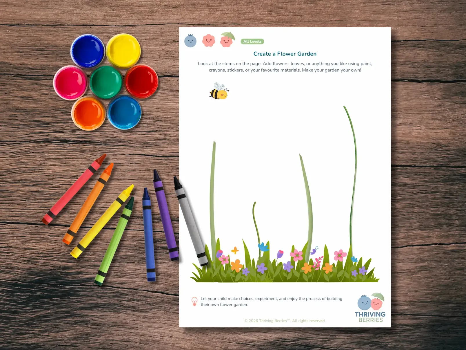 Thriving Berries Monthly Activity Pack on a wooden table